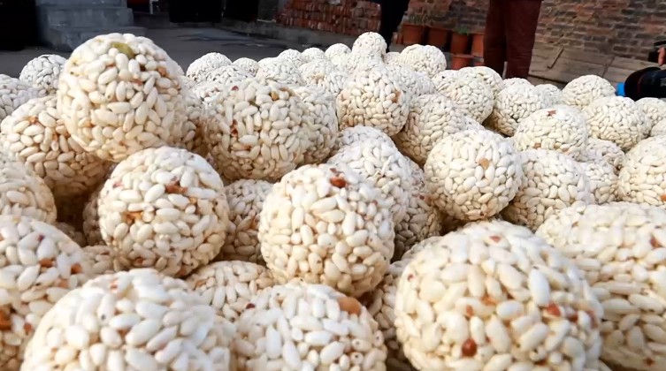 “祖传年货”太好吃 老汉每年要爆2万斤大米